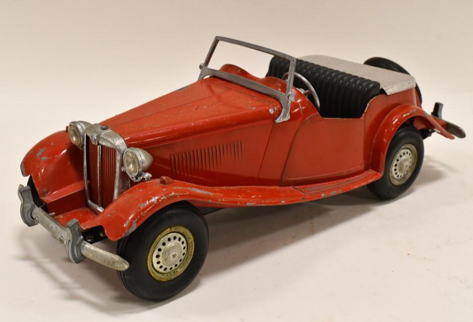 Original Doepke Model Toys MG Roadster: Original 1950's Doepke Model Toys MG Roadster. Nice condition with paint loss and wear from play and age. Both of the tabs on the windshield are broken. Measures approximately 15 1/4" long.