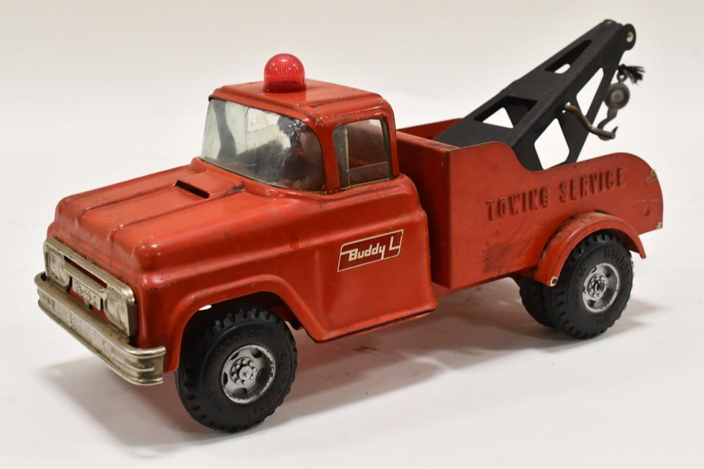 Buddy L Towing Service Wrecker Truck: Buddy L towing service wrecker truck. Displays nicely with some paint loss and wear from play and age. Measures approximately 14" long.