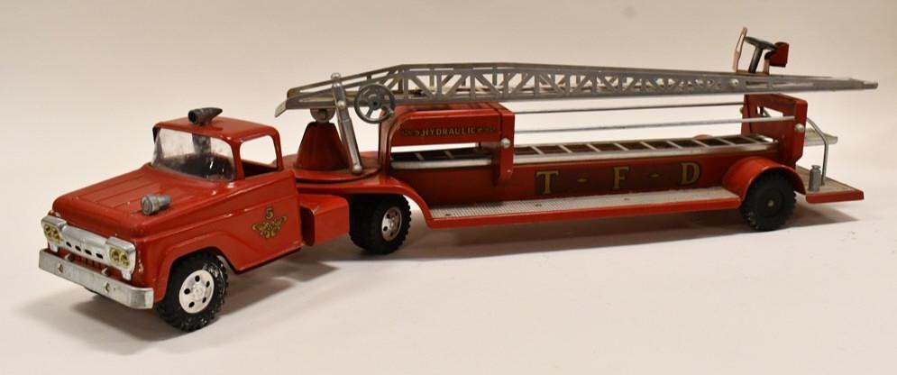 Tonka No. 5 Square Fender Aerial Ladder Fire Truck: Original Tonka No. 5 square fender aerial ladder fire truck. Displays nicely with some paint loss and wear from play and age. Missing one hubcap. Measures approximately 31" long.