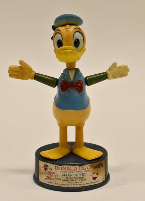 Kohner Donald Duck Mini Push Button Puppet: Kohner Donald Duck mini push button puppet. The push button works. Has some paint loss and wear from use and age. Measures approximately 5 3/4" tall.