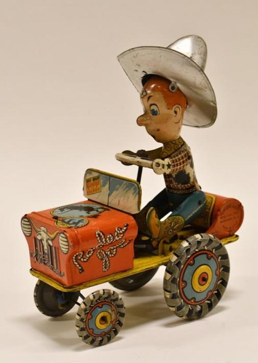 Unique Art Tin Litho Windup Rodeo Joe Crazy Car: Unique Art tin litho windup Rodeo Joe. Displays nicely with wear from age and play. Has paint loss, dents, and scratches. WIndup works. Measures approximately 9 1/2" tall.