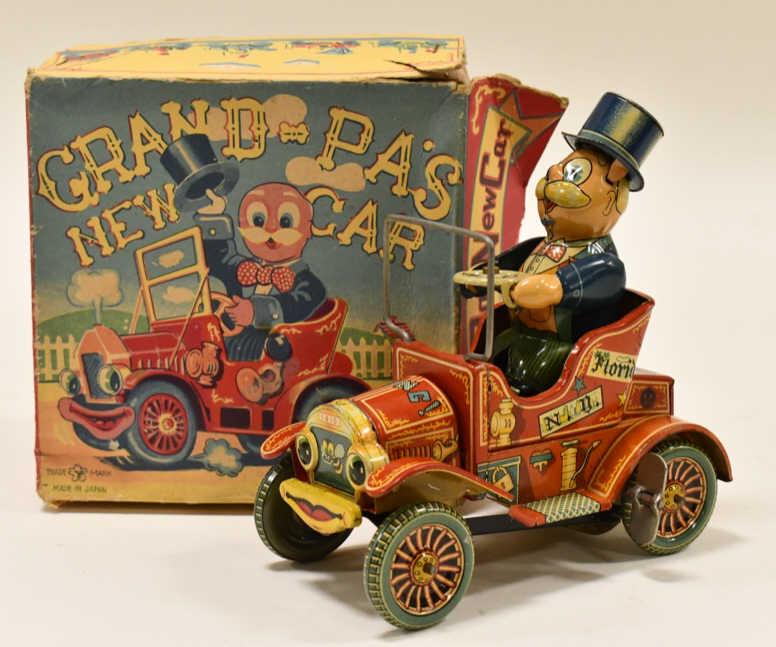 Yonezawa Tin Windup Grandpa's New Car In Box: Yonezawa tin litho windup Grandpa's New Jalopy Car in the box. The toy is in overall nice condition with light wear from age and display. The windup mechanism works. Box has some wear and tear. Measur