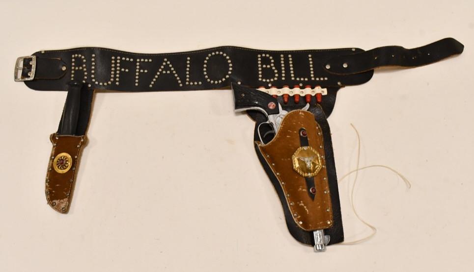 Nichols Stallion 45 Cap Gun w Buffalo Bill Holster: Nichols Stallion 45 cap gun with Buffalo Bill holster. The trigger works on the cap gun, but the cylinder does not spin. The holset includes a rubber knife. Holster has some wear from use and age. Gun