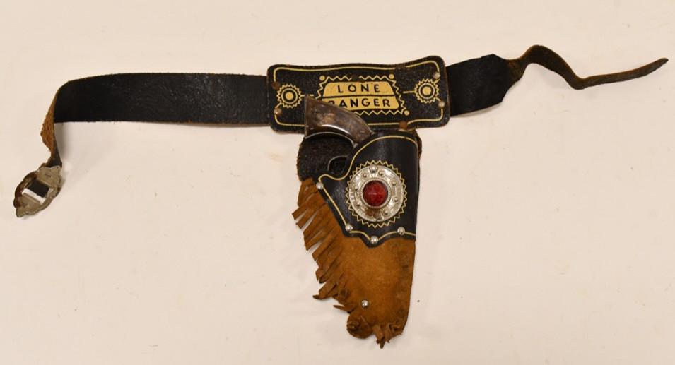 Kilgore Cast Iron Lone Ranger Cap Gun w/ Holster: Kilgore cast iron Hi-Yo Silver Lone Ranger cap gun with Lone Ranger leather holster. The trigger works. The cap guns have corrosion and wear. The leather holster is in nice condition with cracks and w