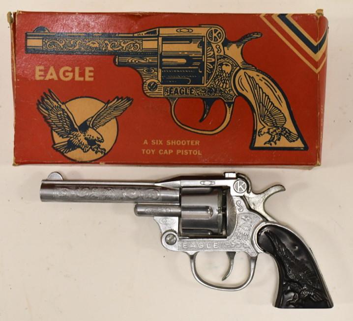 Kilgore Eagle Six Shooter Cap Gun Pistol w Box: Kilgore Eagle six shooter cap gun pistol with the original box. The gun appears to be in working condition with the revolving cylinder. The box has some loose / missing flaps. Displays nicely with wea