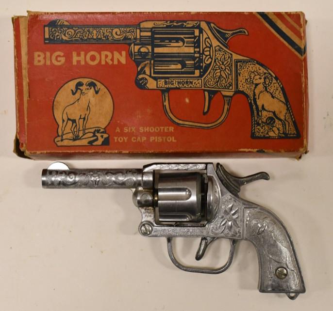 Kilgore Big Horn Six Shooter Cap Pistol w/ Box: Kilgore Big Horn six shooter cap pistol with the original box. The gun is in nice condition with some light wear from use and age. The box has some crushing and is missing one small flap. Gun measures