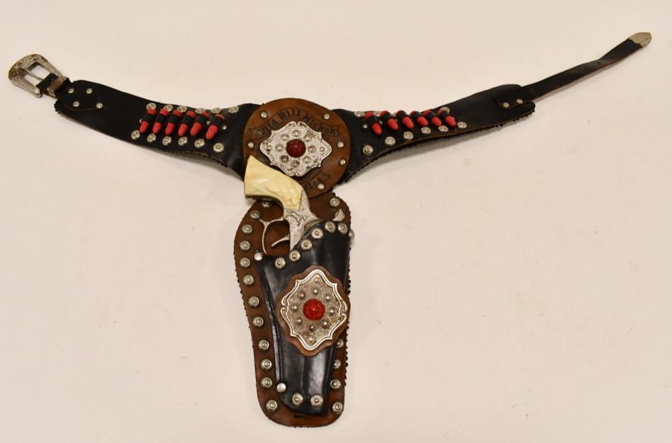 Leslie-Henry Wild Bill Hickok Cap Gun w/ Holster: Leslie-Henry Wild Bill Hickok single cap gun holster set. The cap gun has some corrosion and tarnish from use and age. The triggers work, but the compartment where you put the caps wants to pop up. Th