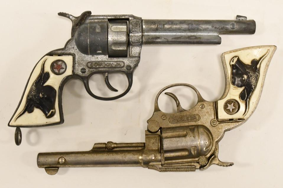 Hubley Western & Cowboy Jr. Cap Guns: Hubley Western and Cowboy Jr. cap gun pistols. The western cap gun doesn't stay latched. Both triggers work. They have some corrosion and wear from use and age. Longest gun measures approximately 9" l