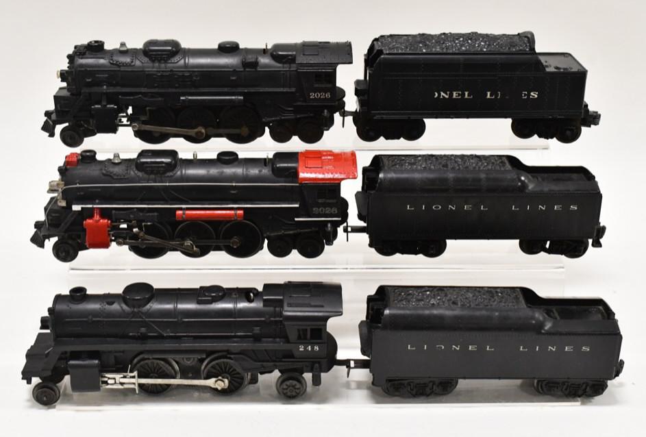 Lionel #2026 , #2026, #248 Engines w/ Tenders: Lionel O-Gauge #2026 Type IV, #2026 Type l, #248 Engines with tenders. One of the tenders has a crack in the body. The one engine has some custom paint. Overall displays well with wear from use and ag