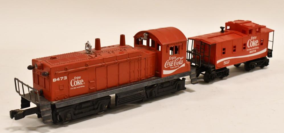 Lionel #8473 Coca-Cola NW-2 Switcher w/ Caboose: Lionel O-Gauge #8473 Coca-Cola NW-2 Switcher with caboose. Displays nicely with wear from use and display.