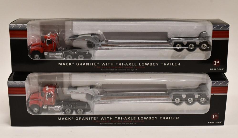 (2) 1/64 1st Gear Mack Granite w/ Tri-Axle Lowboys: Lot of (2) 1/64 scale 1st Gear Mack Granite with tri-axle lowboy trailers. Both are in nice condition in the boxes.