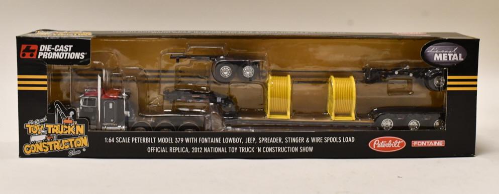 1/64 DCP Peterbilt Model 379 w Lowboy Trailer: 1/64 DCP Peterbilt Model 379 with fontaine lowboy, jeep, spreader, stinger, and wire spools load. Nice condition in the box. Item no. 32754