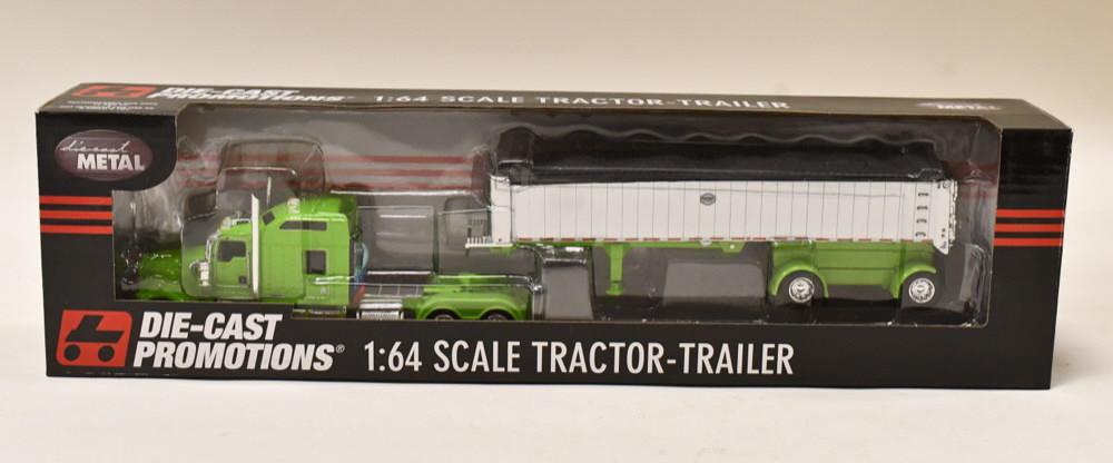 1/64 DCP Kenworth W900 w MAC Coal Dump Trailer: 1/64 DCP Kenworth W900 86" sleeper with spread-axle MAC coal dump trailer. Nice condition in the box. Item no. 33363.