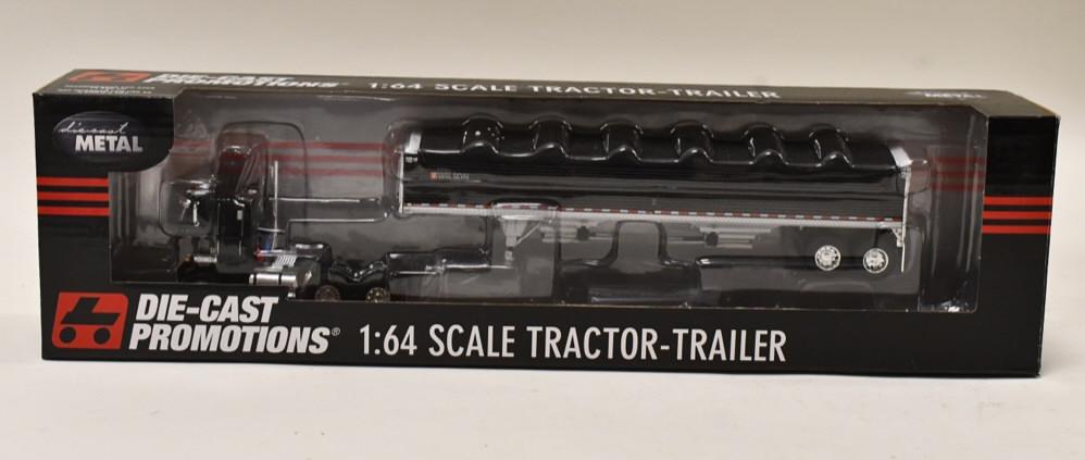 1/64 DCP International Transtar w/ Grain Hopper: 1/64 DCP International Transtar with Wilson grain hopper trailer. Nice condition in the box. Item no. 33579.