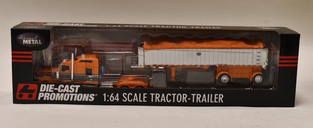 1/64 DCP Kenworth W900 w/ MAC Coal Dump: 1/64 DCP Kenworth W900 86" sleeper with spread-axle MAC coal dump trailer. Nice condition in the box. Item no. 33362.