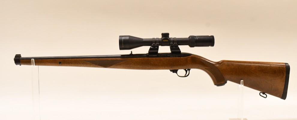 Ruger Model 10/22.22 LR Semi-Automatic Carbine: Ruger Model 10/22 semi-automatic carbine in .22 LR. The rifle is in good used condition and has a 18.5" barrel and Cabela's scope. SN:244-97479. FFL required for transfer. (793-4)