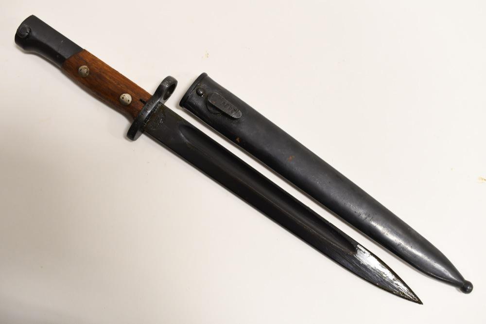 WWII Yugoslavian Mauser 44 M1948 Bayonet: WWII Yugoslavian Mauser 44 M1948 bayonet with scabbard. Nice condition with wear from age and storage. Overall with scabbard it measures approximately 15-1/2" across. Blade measures approximately 10" 