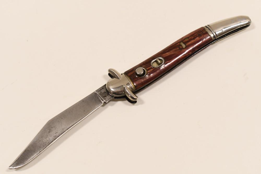 Vintage Hammer Brand Switchblade Folding Knife: Vintage Hammer Brand switchblade automatic folding knife. Fair condition with wear from use and age. Does have some damage to handle grips, and blade does have some nicks near the tip. Blade appears t