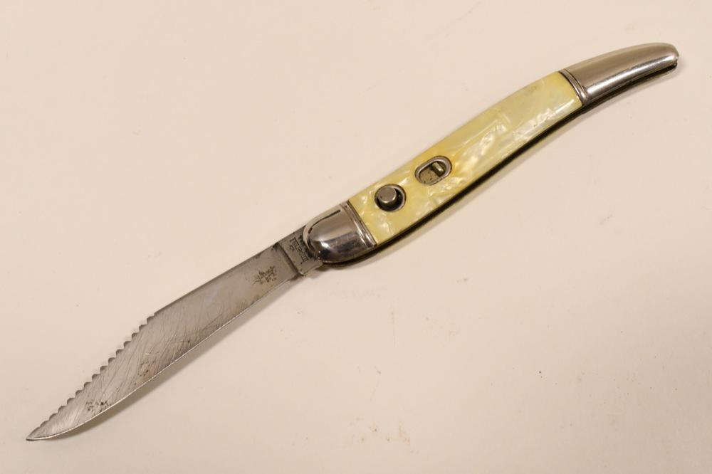 Vintage Imperial Brand Switchblade Folding Knife: Vintage Imperial Brand switchblade automatic folding knife. Good condition with wear from use and age. Blade works well. When closed it measures approximately 4-1/4" across. Blade measures approximate