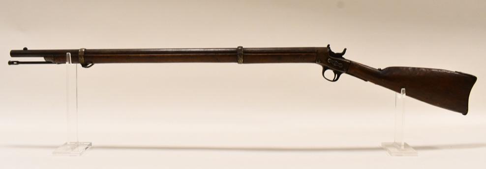 Remington Model 1867 Rolling Block Cadet Rifle: Remington Model 1867 rolling block cadet rifle in .50 caliber. The rifle is in good antique used condition and has a 30" barrel. Includes cleaning rod.