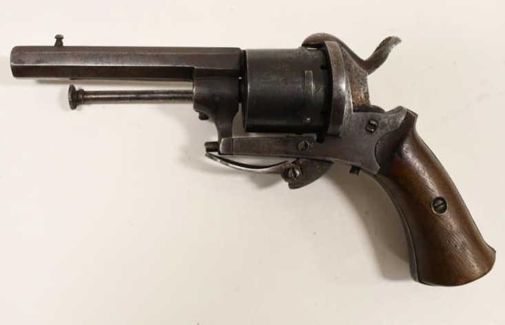 Antique Belgium 7mm Pinfire Revolver: 1870's Belgium pinfire six shot single action revolver in 7mm. The revolver has a 3-1/4" barrel, wood grips, and folding trigger. Good functional condition. SN: 1769