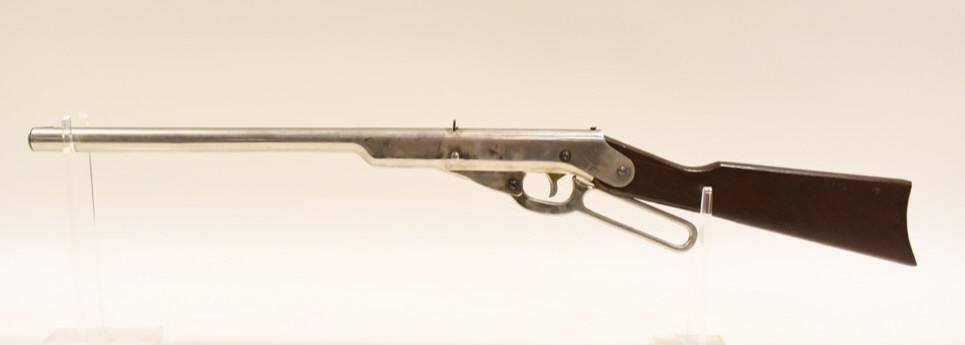 Daisy Model 33 No. 102 Lever Action BB Gun: Daisy Model 33 No. 102 Lever Action BB Gun. Untested, wood stock, good condition with use wear. Engraved "A Xmas Gift" & "JG." on the butt stock. Nickel finish.
