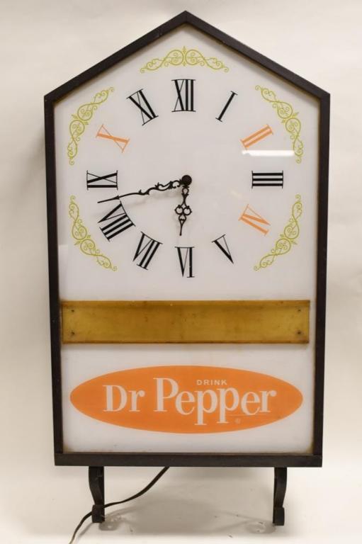 Large Vintage Dr. Pepper Lighted Adv Clock: Large vintage Dr. Pepper lighted advertising clock. Clock is in fair condition with fading, paint loss and surface rust on can, and wear from use and age. Clock works, but is not currently lighting up