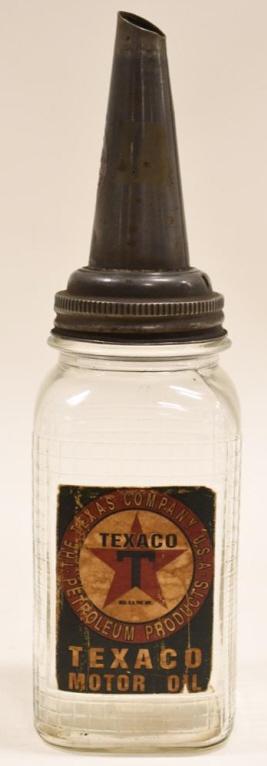 Texaco Glass Oil Bottle w/ Paper Label & Spout: Texaco Motor Oil glass oil bottle with paper label and spout. Nice condition with some wear. Label has discolorationa dn edge wear. Bottle still has some oil in the bottom. Overall with spout it measu