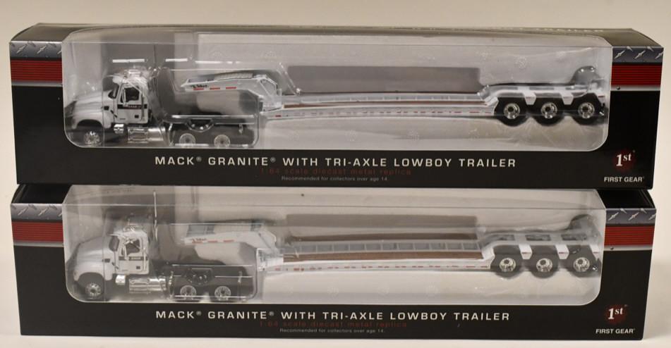 (2) 1/64 1st Gear Mack Granite Trucks w/ Lowboys: (2) 1/64 scale 1st Gear Mack Granite trucks with tri-axle lowboy trailers. Good condition in the boxes.
