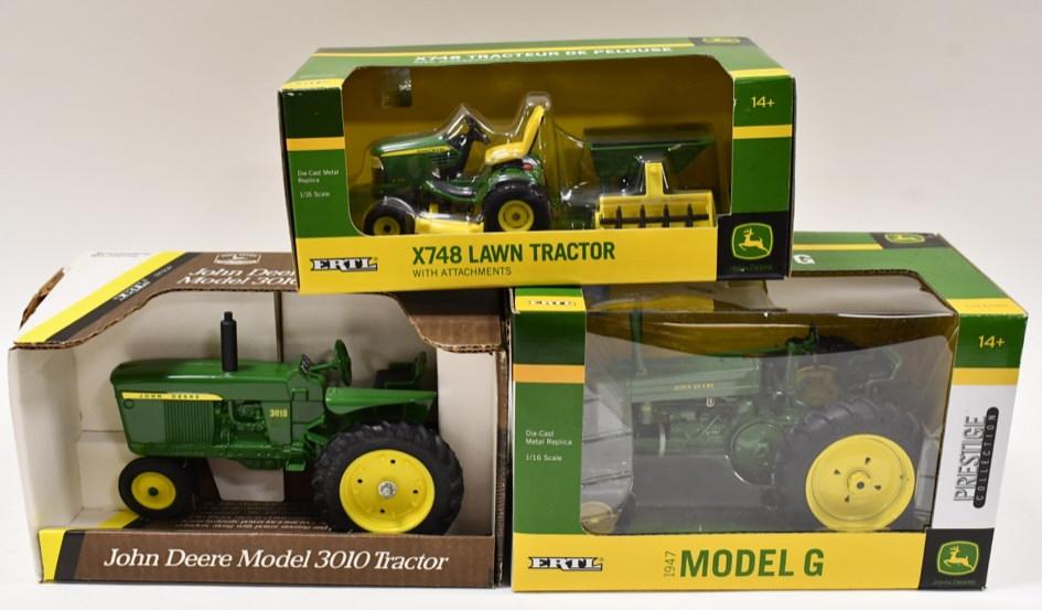 1/16 John Deere Model G, 3010, X748 Lawn Tractor: 1/16 scale Ertl John Deere Model G, John Deere Model 3010, and X748 lawn tractor. Good condition in the boxes.