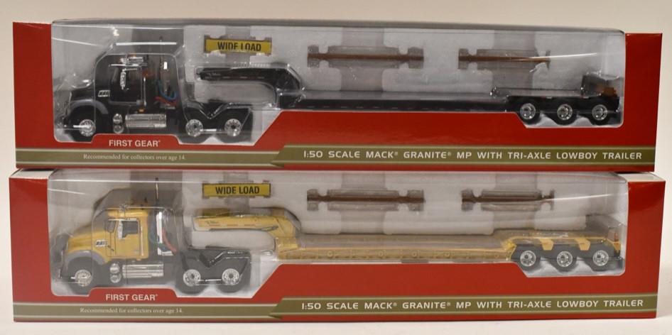 (2) 1/50 1st Gear Mack Granite w/ Tri-Axle Lowboys: (2) 1/50 scale 1st Gear Mack Granite MP trucks with tri-axle lowboy trailers. Good condition in the box.