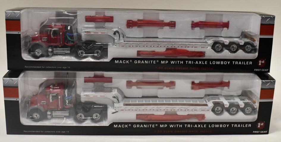 (2) 1/50 1st Gear Mack Granite MP w/ Lowboys: (2) 1/50 scale 1st Gear Mack Granite MP semi trucks with tri-axle lowboy trailers. Good condition in the boxes.