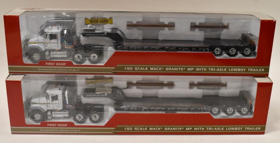 (2) 1/50 1st Gear Mack Granite MP w/ Lowboys: (2) 1/50 scale 1st Mack Granite MP semi trucks with tri-axle lowboy trailers. Good condition in the boxes.