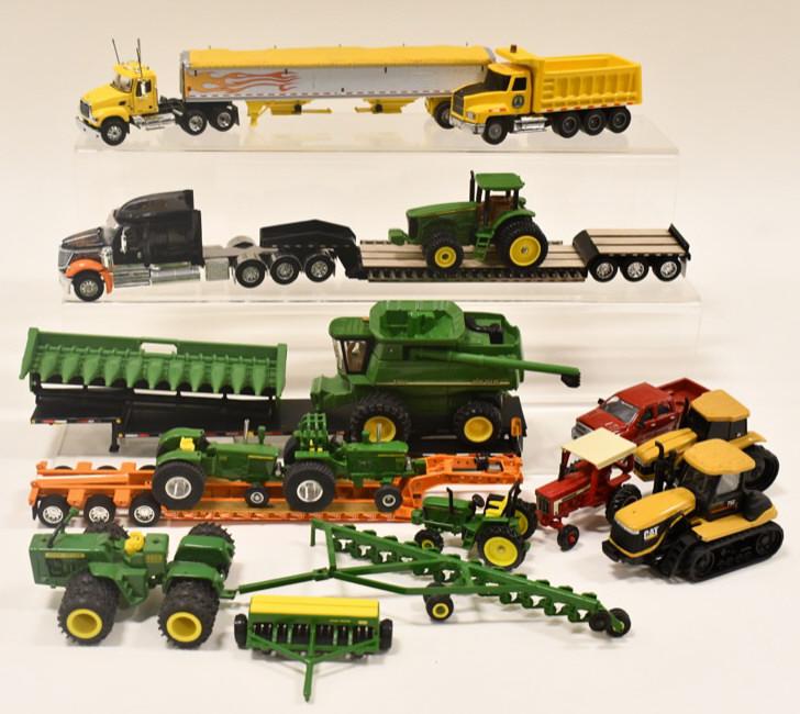1/64 John Deere, Caterpillar, & DCP Trucks: 1/64 scale Caterpillar and John Deere tractors and combine. Also includes DCP semi trucks with trailers.