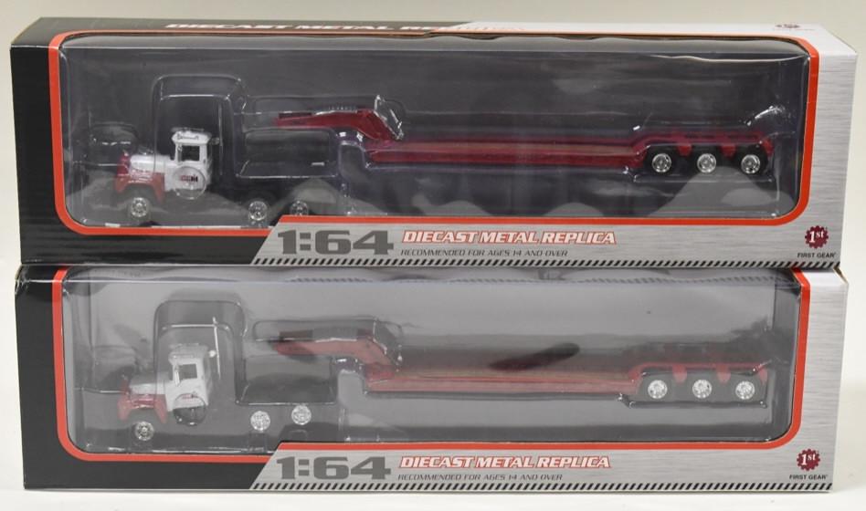 (2) 1/64 1st Gear Mack R-Model Mack w/ Lowboys: (2) 1/64 scale 1st Gear Mack R-Model trucks with lowboy trailers. Good condition in the boxes.