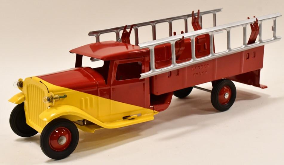 Restored Buddy L Ladder Truck With Headlights: Restored Buddy L ladder truck with headlights. Displays well with a yellow and red paint job, headlights,and "Ladder Truck" embossed each side of the bed of the truck. Good condition with light wear f
