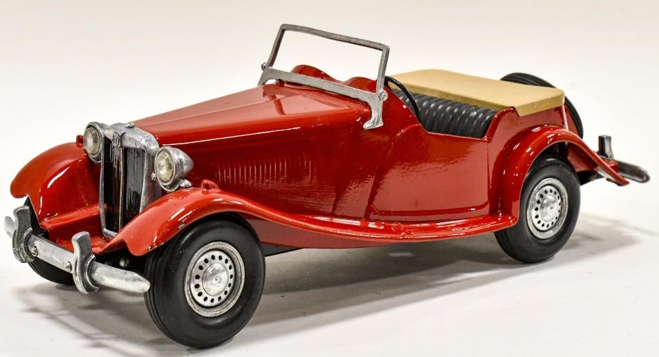 Restored Doepke Model Toys MG Roadster: Restored Doepke Model Toys MG Roadster. Good condition with a couple small paint chips and light wear from storage and display. One of the tas on the windshield is broke. Measures approximately 15" lo
