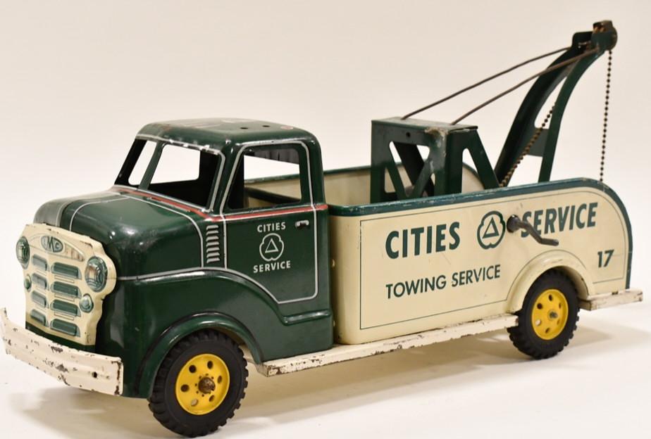 Marx Cities Service Wrecker Tow Truck: Marx Cities Service wrecker tow truck. Displays nicely with paint loss and wear from play and age. It is missing the siren on the cab. Measures approximately 18 1/2" long.