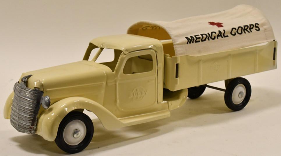 Restored Buddy L Medical Corps Truck: Restored Buddy L Army Medical Corps truck. Displays well with medical corps tarp and Buddy L embossed on the doors. Good condition with a couple small paint knicks and light wear from storage and disp