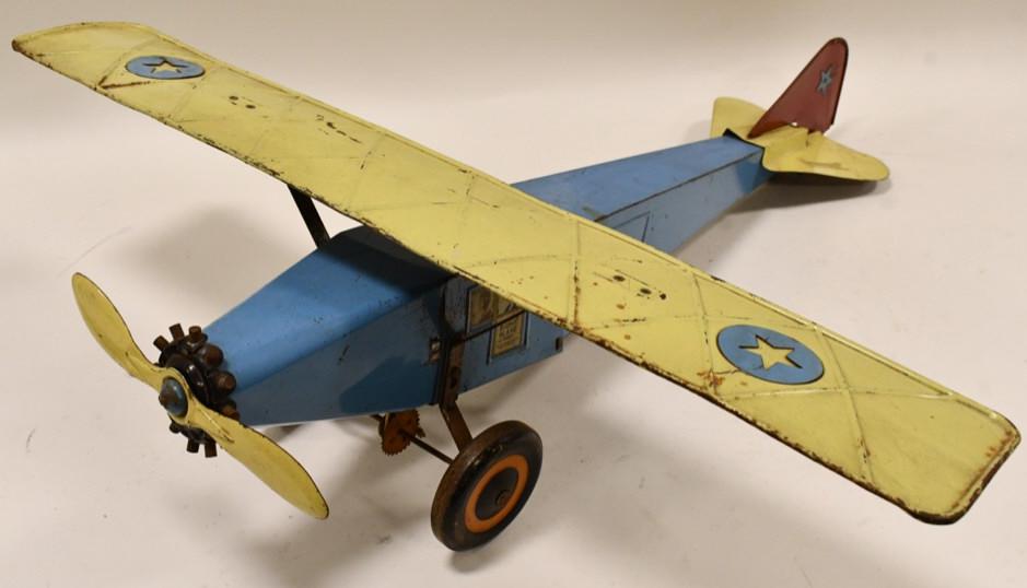 Early Schieble The Right Plane No. 20: Early Schieble "The Right Plane" No. 20 mono-wing plane. Overall it is in good condition with some paint loss and wear from play and age. The propellor moves when the wheels are spun, but the pulley h