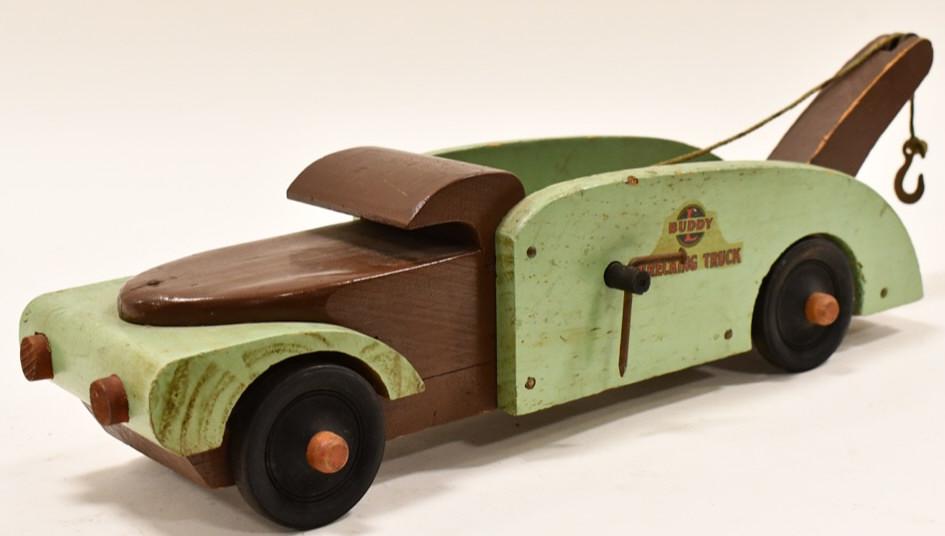 Buddy L Wood Toys Wrecking Truck: Buddy L wood toys WWll era wrecking tow truck. The truck has some paint loss and wear from play and age. Measures approximately 17" long.