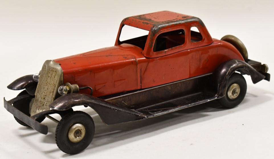 Hoge Mfg. Co. Windup Fire Chief Car: Hoge Mfg. Co. windup Fire Chief car. Displays nicely with headlights and nickel plated spare tire. The windup and siren works, but are pretty weak. The car has some paint loss and wear from play and a