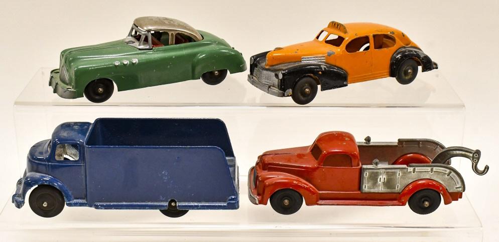 Lot Of Hubley & Slik Delivery Truck, Taxi, & More: Lot includes a Hubley tow truck, taxi, and Buick convertible. Lot also includes a Slik-Toys delivery truck. All have some paint loss and wear from play and age. Displays nicely. Largest measures appro