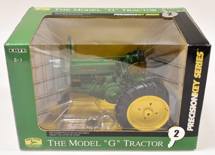 1/16 Ertl John Deere Model G Precision Key Series: 1/16 scale Ertl John Deere model G tractor. Precision Key series #2. Good condition in the box.