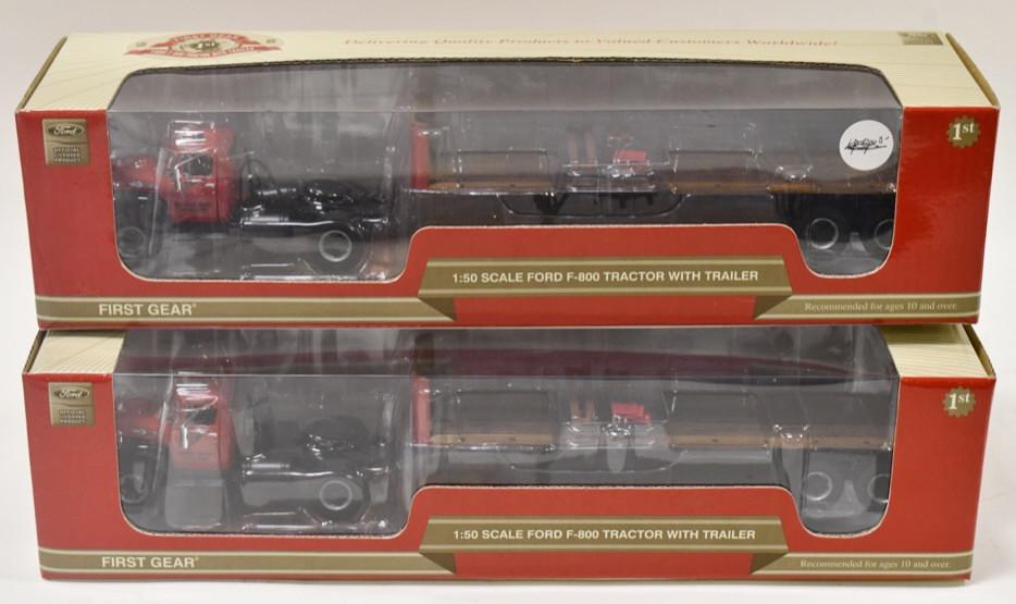 (2) 1/50 1st Gear Ford F-800 Tractor w/ Trailer: (2) 1/50 scale 1st Gear Ford F-800 tractor with trailer. Good condition in the boxes.