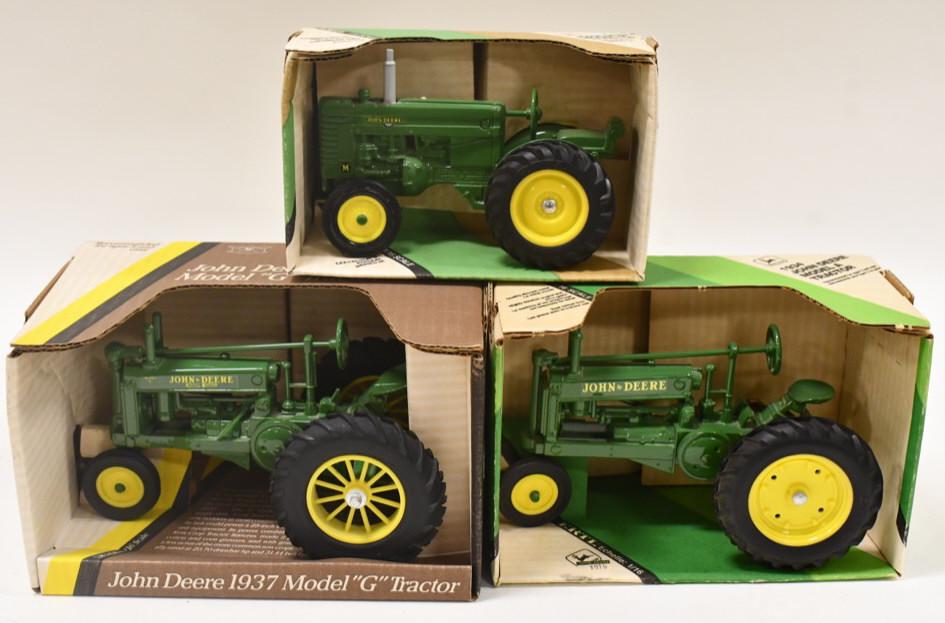 1/16 Ertl John Deere Model A, G, & M Tractors: 1/16 scale Ertl John Deere Model A, Model G, and Model M tractors. Good condition in the boxes.