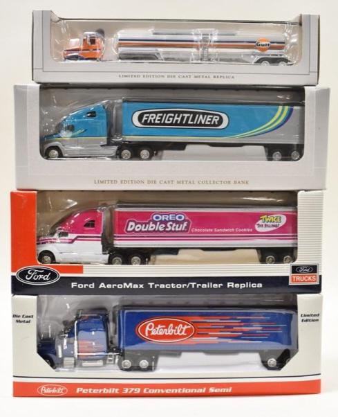 1/64 SpecCast Peterbilt Ford & Freightliner Trucks: 1/64 scale SpecCast Peterbilt with Gulf oil tanker, Ford AeroMax tractor, Peterbilt 379, and Freightliner truck. Good condition in the boxes.