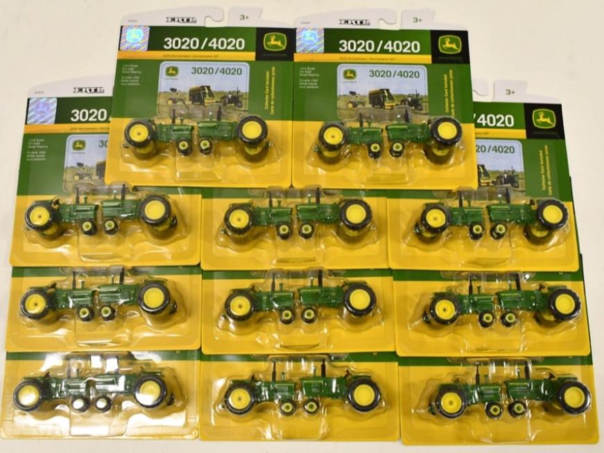 (11) 1/64 Ertl John Deere 3020 / 4020 Tractor Set: (11) 1/64 scale Ertl John Deere 3020 / 4020 tractor set. Good condition in the packages.