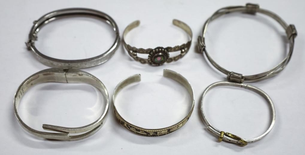 Set of 6 Sterling Cuff Bracelets: Set of 6 Sterling Cuff Bracelets. One Signed Randall Begay, Belt Buckle Style, Intertwined Strands and more. Weighs 132.2 grams