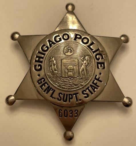 Obsolete Chicago Police Gen. Supt. Staff Badge: Obsolete Chicago Police General Superintendent Staff Badge 6033. Shows average wear from use and age. Marked The CH Hanson Co Chicago. Measures 2.5" tall and 2.25" wide.